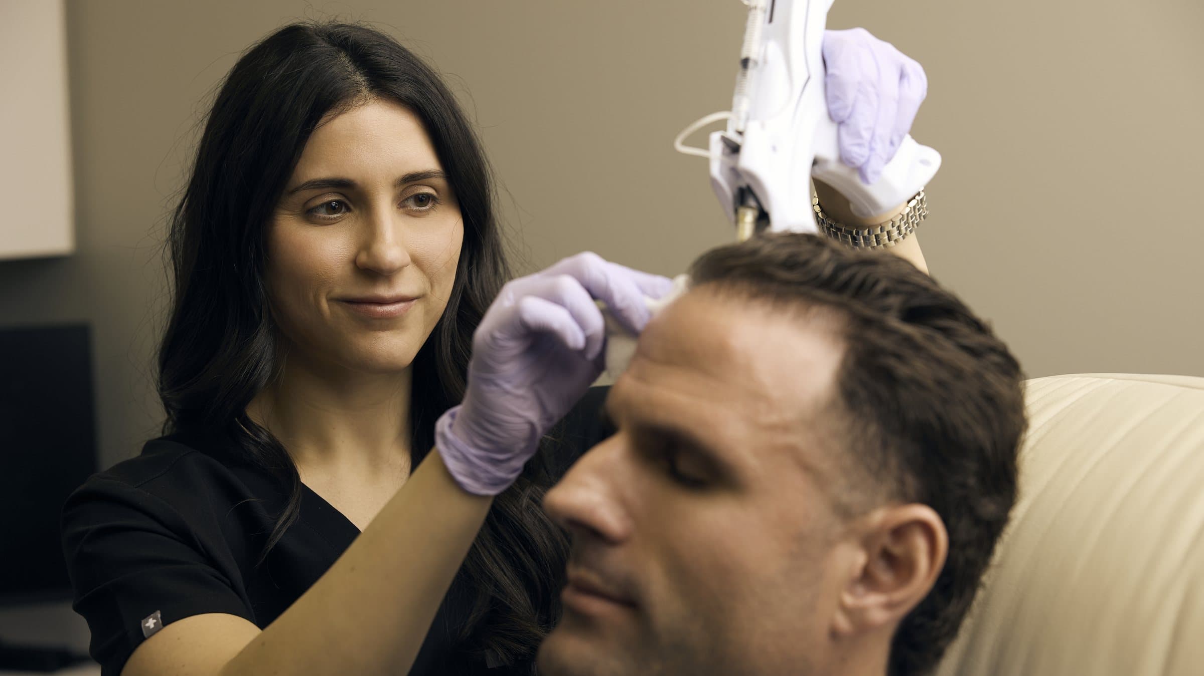 Antoinette Heil, PA-C, performing a PRP scalp treatment