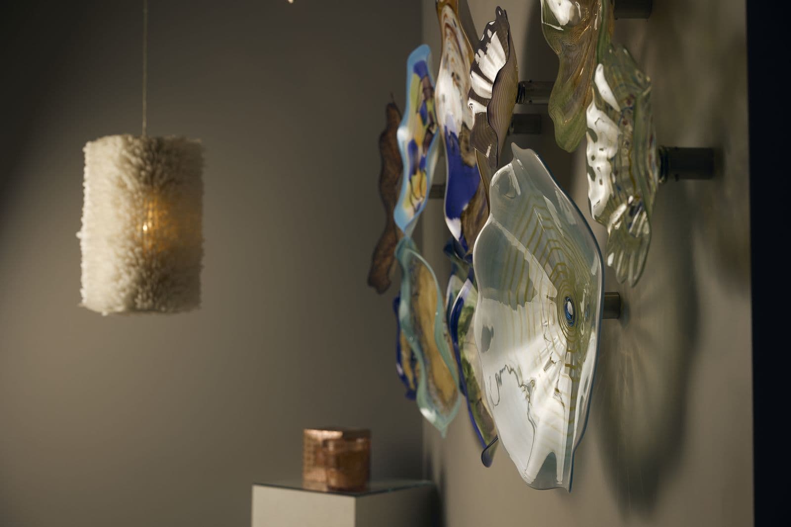 Blown-glass flowers hanging in the Wexford office